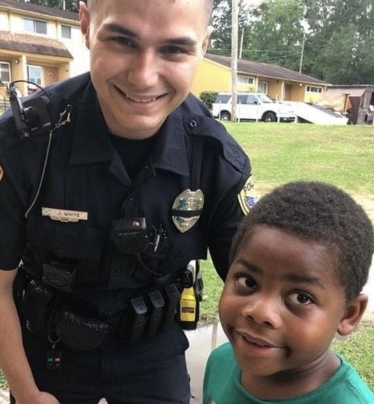 A child dials 911 seeking assistance from police officer.