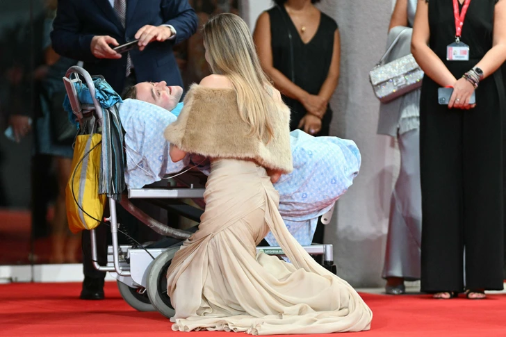 Angelina Jolie Bends Down on the Venice Red Carpet to Chat With a Paralyzed Fan