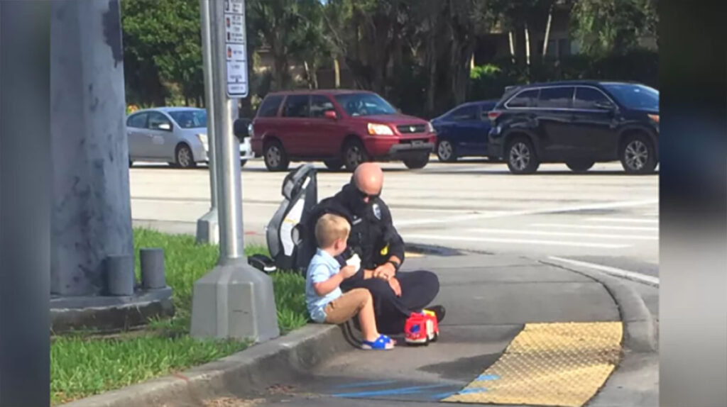 A police officer was sitting next to a young boy and told him few things that moved us to tears